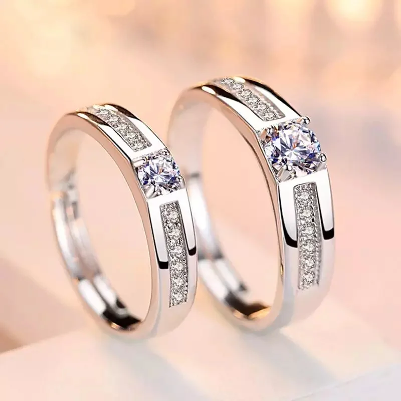 Two matching adjustable ARC rings with round center accents and narrow accent rows
